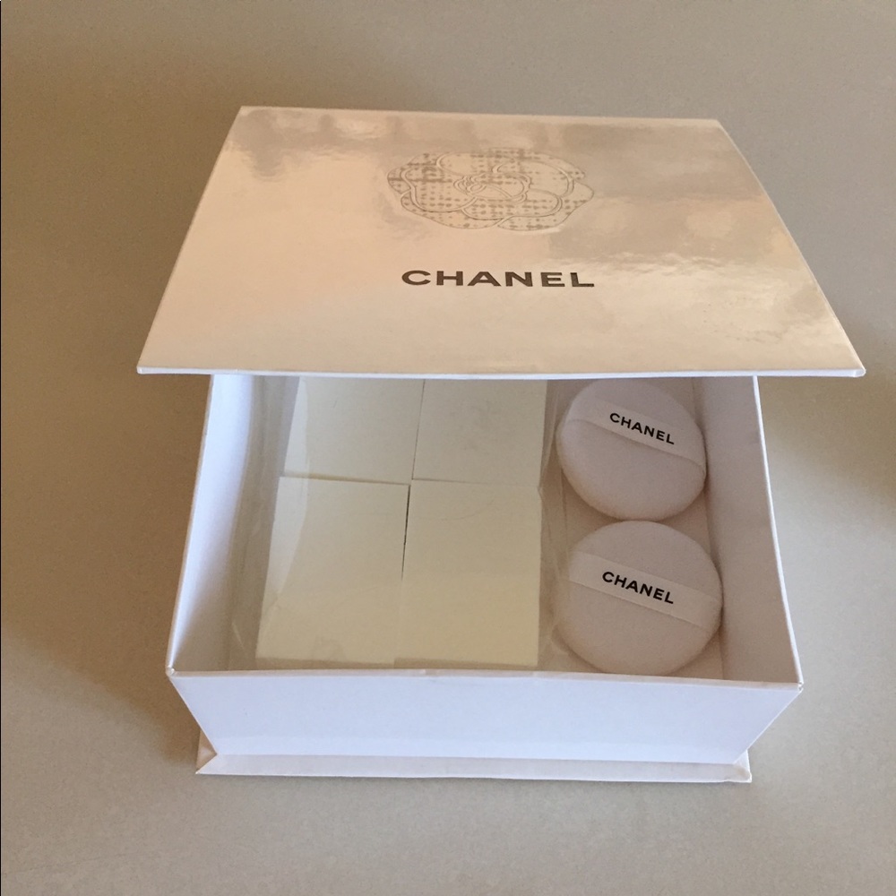 Chanel box -makeup applicators and 2 Chanel puffs.